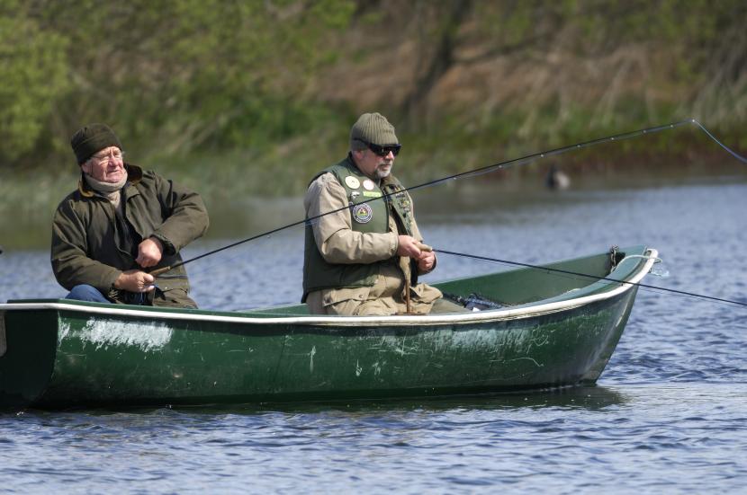 Fisherman fly fishing from a boat, Carsie, Blairgowrie, Tayside and Clackmannanshire Area. May 2005