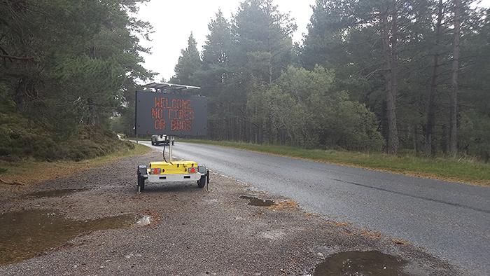Variable message sign at roadside showing 'welcome, no fires or bbqs' message