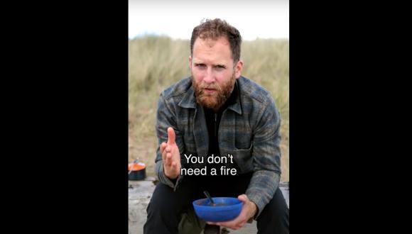A still image from a video showing Calum Maclean sitting and holding a bowl. Text on the image says: You don't need a fire.
